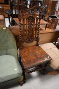 A 19th Century oak Carolean style hall chair