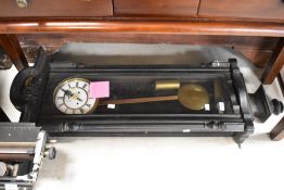 A late 19th or early 20th Century Vienna style wall clock in dark stained case