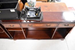 A reproduction Regency mahogany low bookshelf, width approx. 152cm