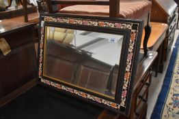 A vintage mirror having ceramic tile surround, possibly a Crown Derby pattern, approx. 54 x 39cm