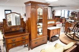 An Art Nouveau mahogany three piece bedroom suite , having typical inlay and transfer decoration
