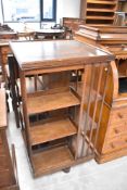 A 20th Century oak revolving bookcase, approx. height 115cm, width 60cm
