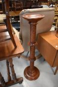 A modern hardwood jardiniere stand