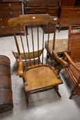 A traditional spindle back rocking chair