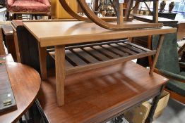 A vintage teak or sapele coffee table having slatted undertier, width approx. 112cm