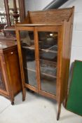 An early 20th Century oak bookcase of narrow proportions, width approx. 65cm