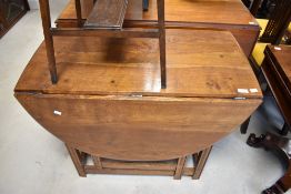 A mid to late 20th Century oak gateleg table having oval top, width approx. 91cm
