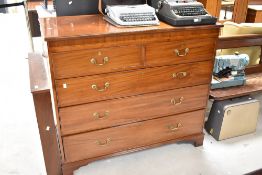 An Edwardian mahogany chest of two over three drawers having inlaid decoration and bracket feet,