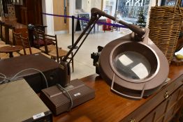 A vintage angle poise magnifying lamp, labelled for ICI