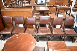 A set of five late 19th or early 20th Century heavy carved dining chairs having vinyl seats and