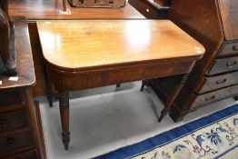 A Victorian nmahogany fold over tea table, width approx. 95cm