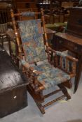 A 19th Century stained frame American style rocking chair