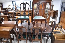 A set of six late 19th or early 20th mahogany dining chairs , having foliate backs, drop in seats