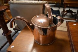 A vintage copper water can, possibly brewery related