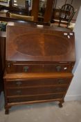 A mid to late 20th Century mahogany bureau