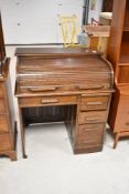 A late 19th or early 20th Century roll top desk of small proportions, width approx. 91cm