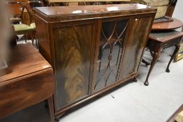 An early 20th Century mahogany bookcase having central display section, dimensions approx. W132 H108