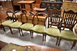 A set of six Victorian walnut rail back salon chairs