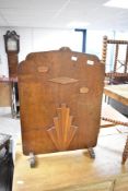 An Art Deco style ply fire screen