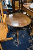 A 19th Century mahogany occasional table having circular top, turned column and triple splay legs (