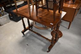 A Victorian mahogany side table having turned frame, width approx. 88cm
