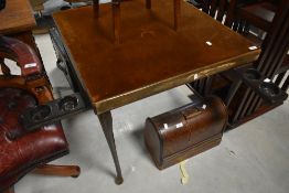 A vintage card table having folding mechanism with pop out bakelite drink/ash/money trays