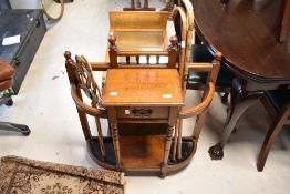 An early 20th Century golden oak hall stand having turned frame, approx. width 72cm, height 86cm