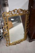A vintage wall mirror having foliate gilt frame, approx. 72 x 52cm
