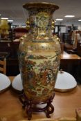 A reproduction Chinese tall floor vase on stand