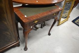 A Georgian and later mahogany side table having leather inset top with frieze drawer and cabriole