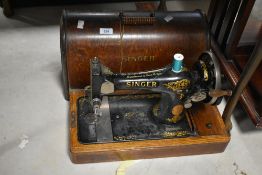 A Singer sewing machine in domed case