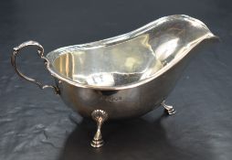 A George V silver sauce boat, of traditional form having a moulded rim and generous spout opposed by