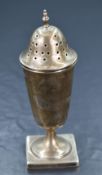 A George VI silver sugar caster, having a pierced, finial topped cover over the fluted body, with