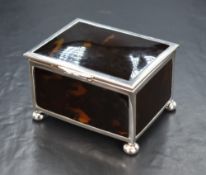 A George V silver mounted tortoiseshell trinket box, of hinged rectangular form having tortoise