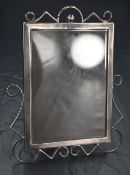 A Victorian Art & Crafts silver photograph frame, of rectangular form having geometric wirework to