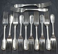 A set of twelve Victorian silver fiddle pattern forks, having a heraldic crest to the terminals,