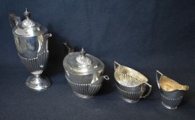 A Victorian silver four piece tea set, comprising a teapot, coffee pot, sugar and cream, of oval