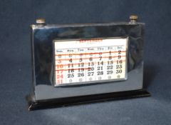 A George VI silver mounted perpetual desk calendar, of rectangular form having rollers to mark