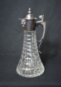 An Elizabeth II silver mounted cut glass decanter, the finial topped cap to the mount with a short