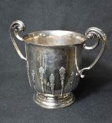 A large late Edwardian silver wine cooler, of traditional form having a slightly flared rim,