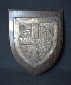 A 20th century white metal varsity shield depicting the University of Cambridge coat of arms,