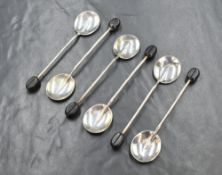 A cased set of George V silver coffee bean spoons, having a rat tail style design, marks for