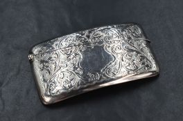 A George V silver visiting card case, of hinged rectangular form, curved for the gentleman's pocket,