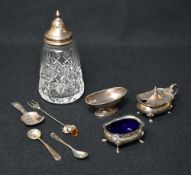 An Elizabeth II silver mounted cut glass sugar caster, of traditional form having a pointed finial