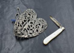 A Victorian silver heart shaped belt buckle, having pierced decoration depicting the god Hermes with
