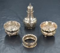 A pair of Edwardian silver salts, of circular form having crimped rim and embossed scroll decoration