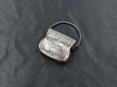 A 19th century silver vinaigrette, in the form of a purse, having floral engraving to the front