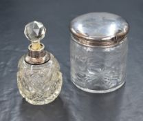Two George V silver mounted and capped vanity wares, comprising a powder pot having engraved