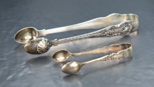 A pair of 19th century silver sugar tongs, having embossed shell and scroll decoration, marks for