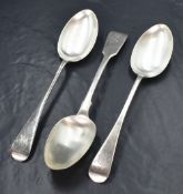 A pair of Edwardian silver Old English pattern serving spoons, having 'MW' monogram to the